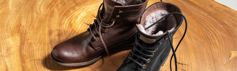 A pair of Floris van Bommel winter boots on a wooden surface, with one boot showing dark brown leather and the other showing black leather.