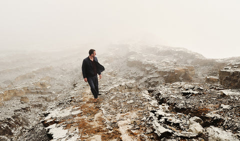 Man Floris van Bommel wearing Floris van Bommel shoes in a snowy mountain landscape
