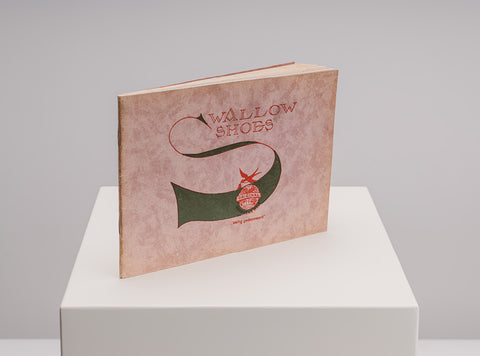 A vintage hardcover book titled 'Wallow Shoes' by W.B. Floris van Bommel